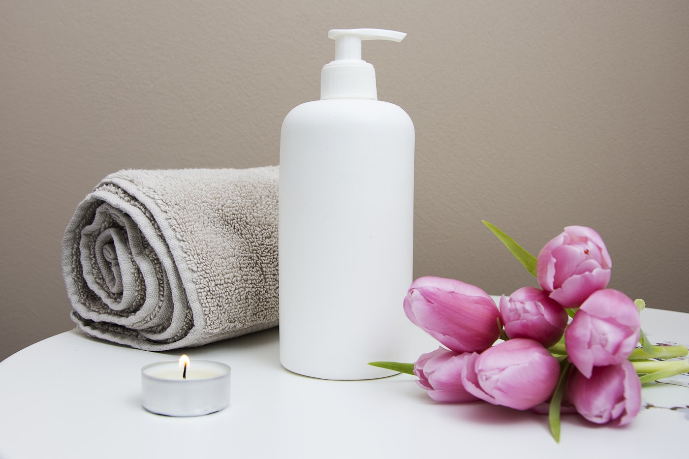 Swedish massage spa setting with towels and candle